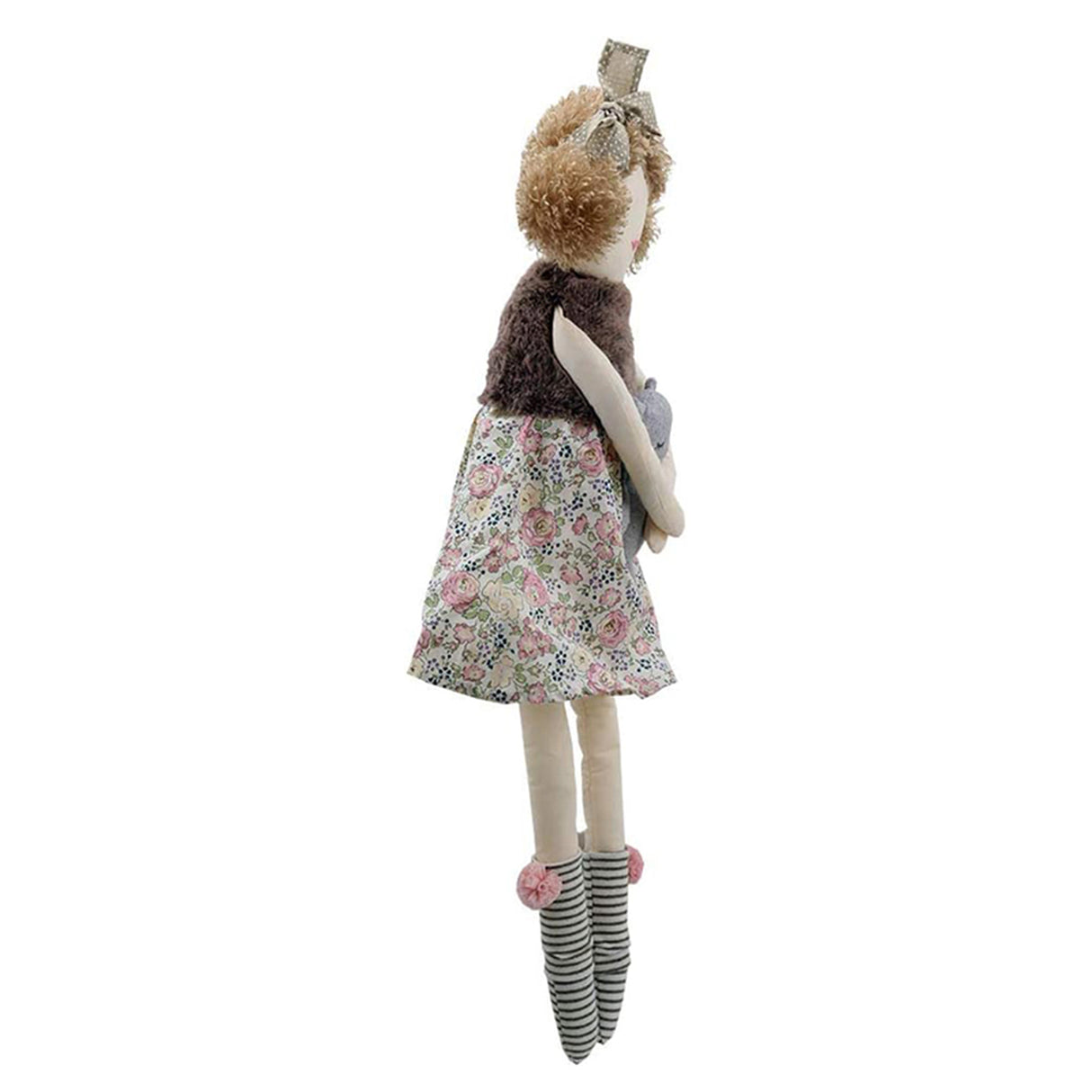 Stuffed animal wearing a floral dress and striped socks on a white background