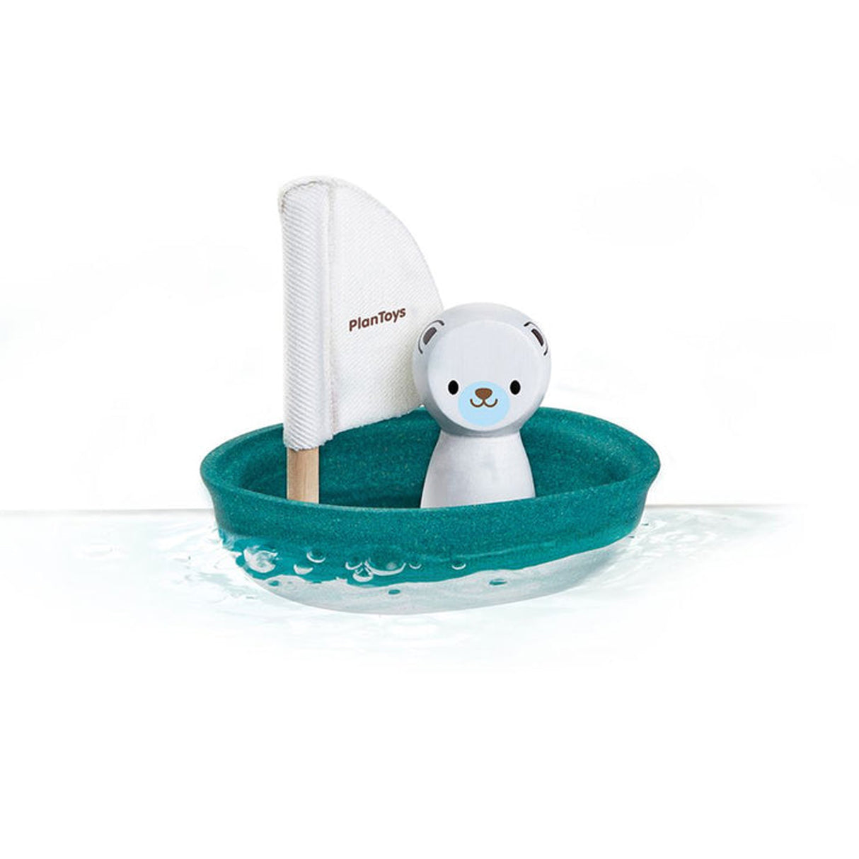 Toy boat with a polar bear and sail on a white background, branded 'Plan toys'.