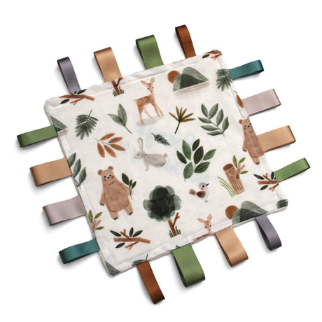 Fabric taggy blanket with woodland animal, trees and leaves on a white background