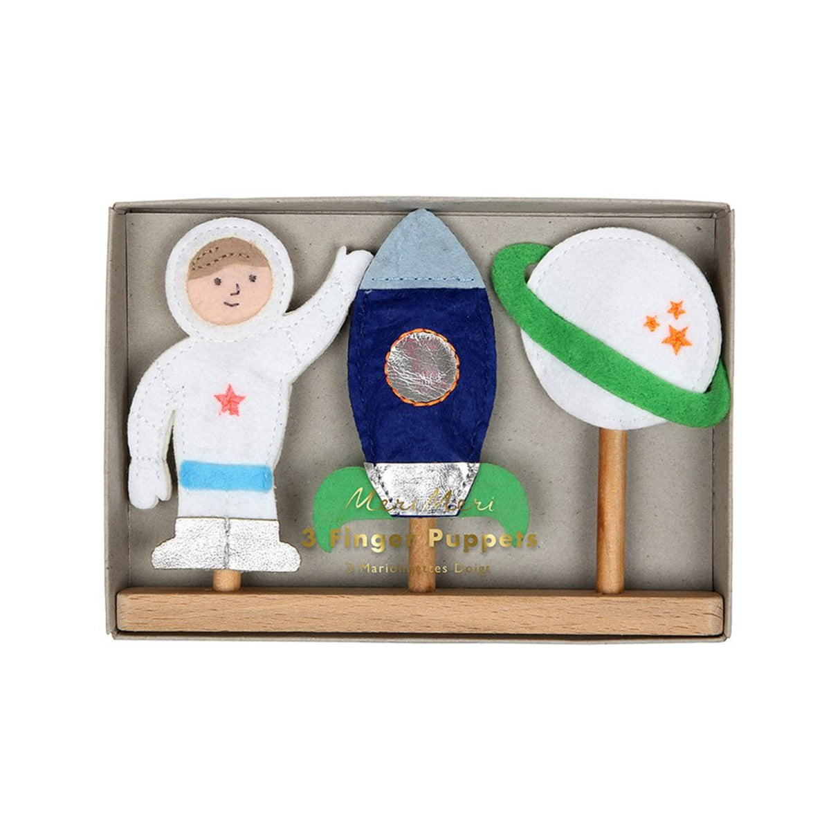 Felt space-themed toys including an astronaut, rocket, and planet in a box with '3 Fingers Puppets' writen in gold and meri meri branding.