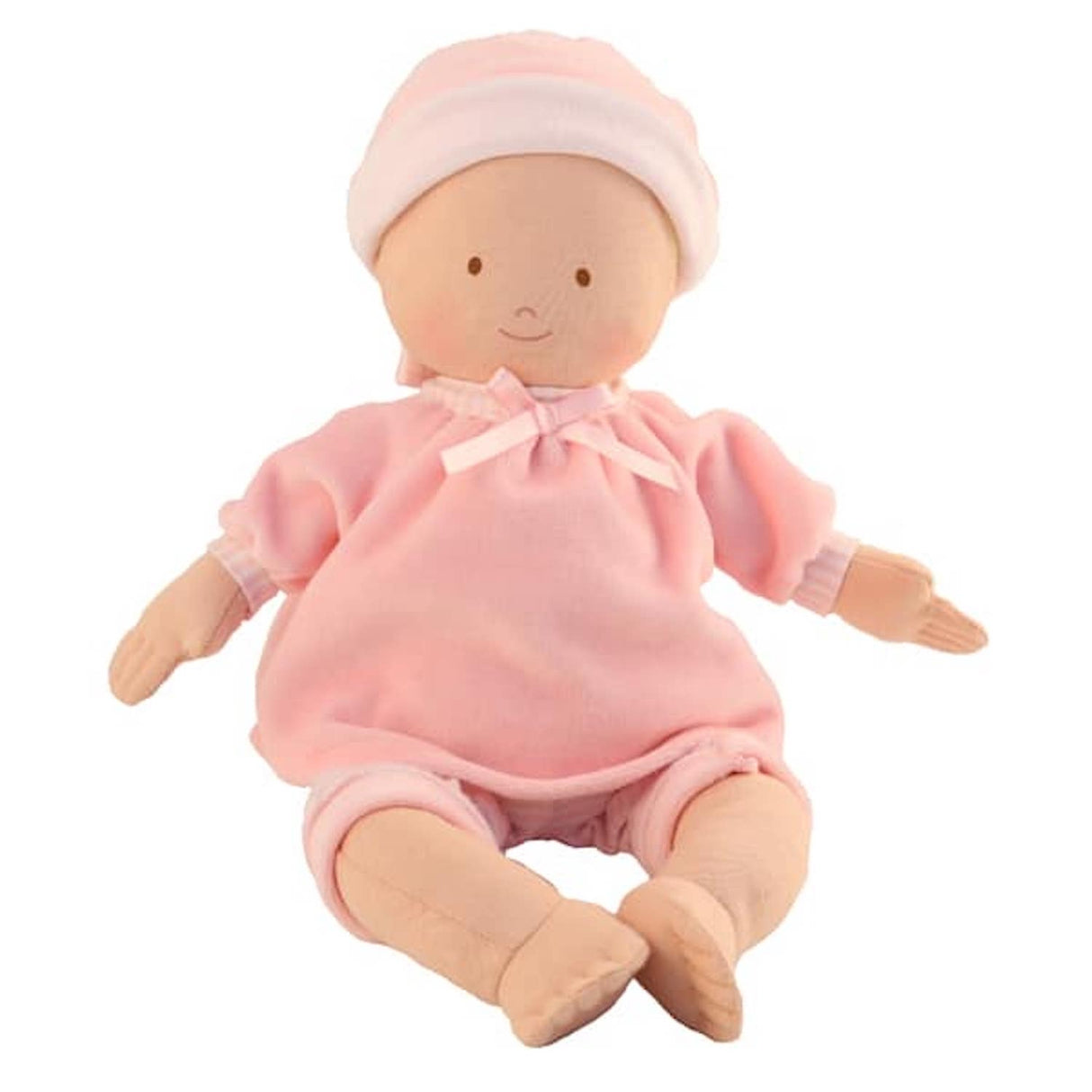 A soft Bonikka Cherub Baby Doll in pink, wearing a pink top, matching hat, and pink trousers, sitting upright.