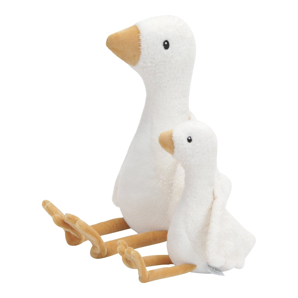 A soft large cuddly goose soft toy and a baby goose made with whte body and wings and a orange beak and feet.