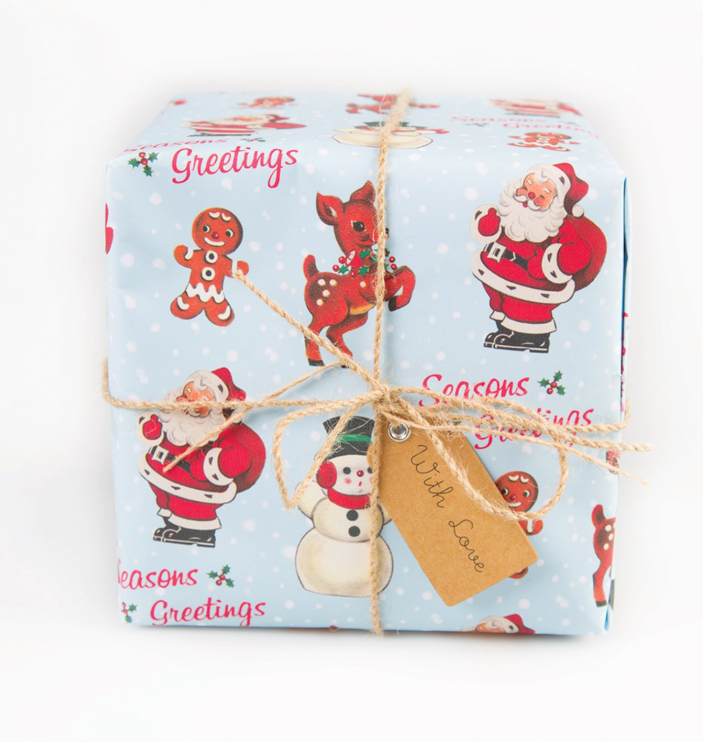 Close up of Beautiful Vintage Christmas Santa Wrapping Paper with Santa, Snowman and reindeer on blue paper. Ideal for Christmas, Birthdays and Christenings