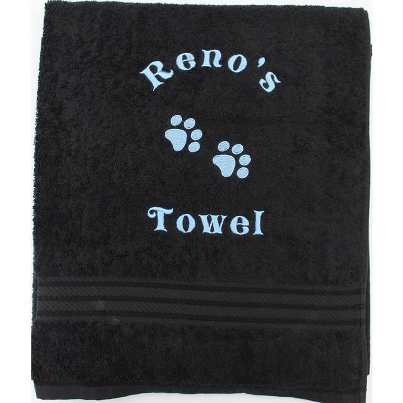 A large size black Personalised Dog Bath Towel with name and paw prints