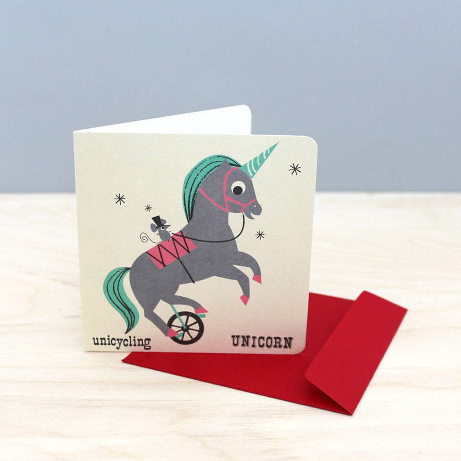 Noodoll retro style unicycling unicorn child or baby greeting card in a nostalgic flash learning cards design