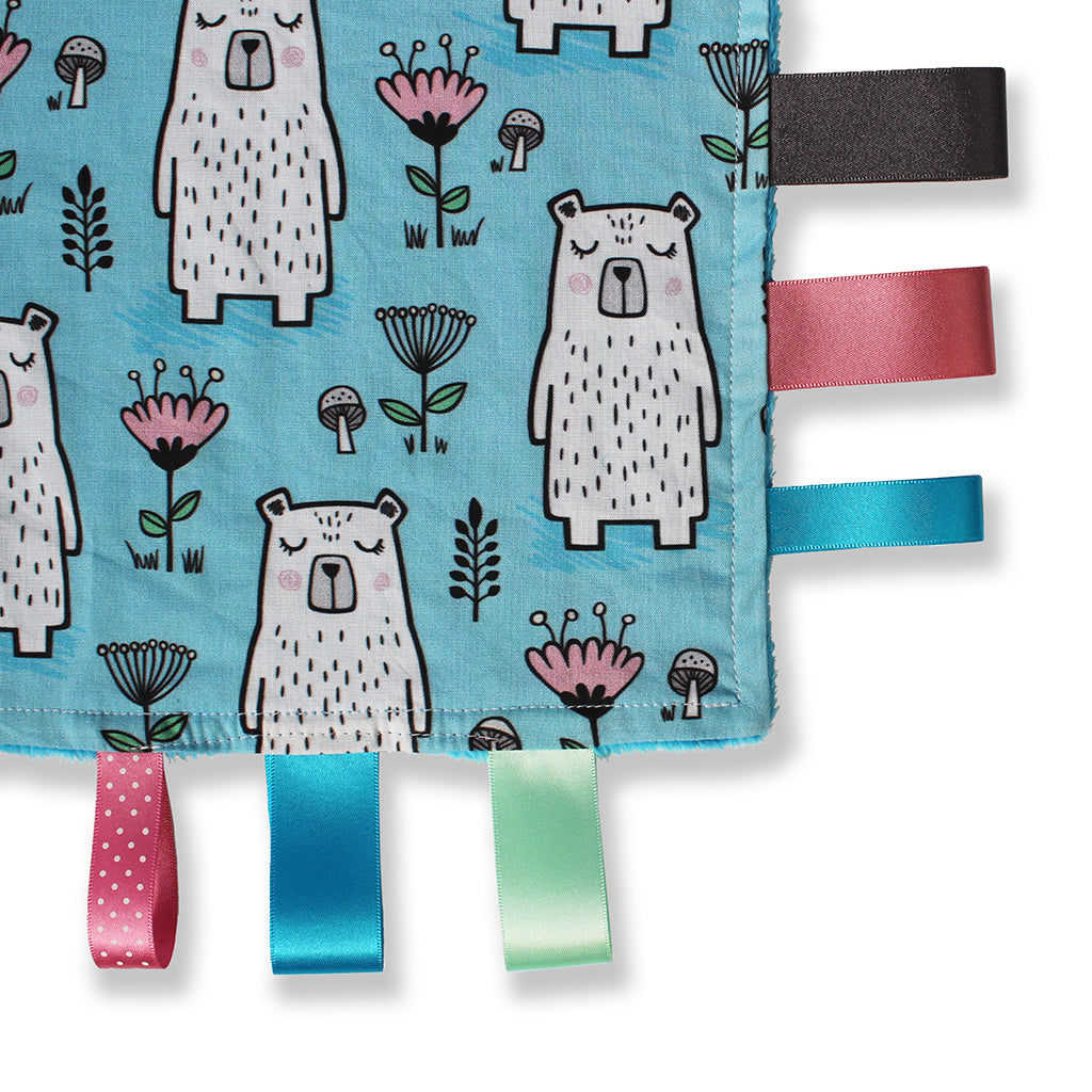 Close up view of a lovely unique handmade Baby Taggy comforter which can be personalised.100% soft cotton, printed using an eco-friendly process