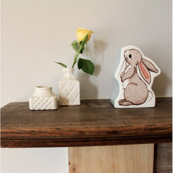 A charming money box. Crafted from flawless, pure china, it took the form of an adorable bunny