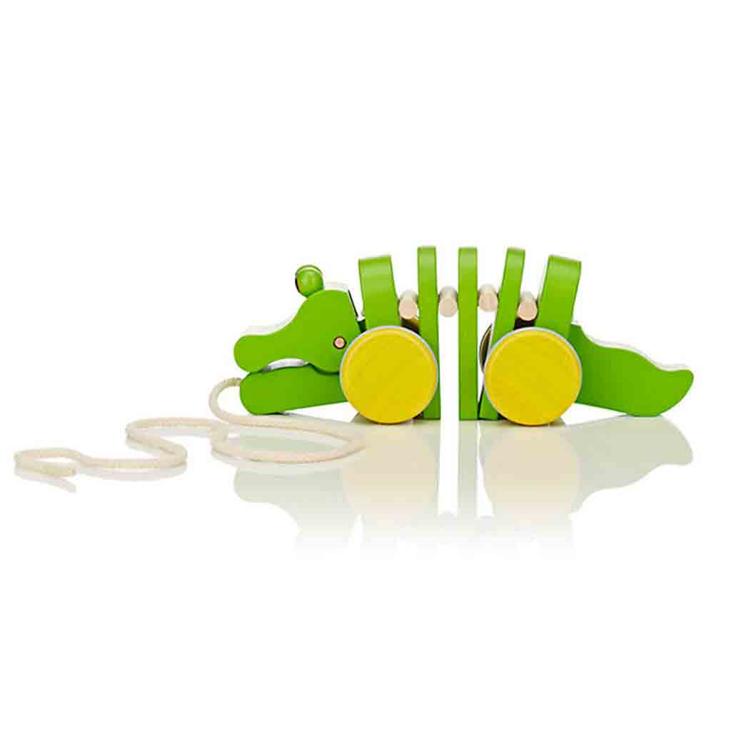 side view of a Plan Toys Eco Friendly Dancing Alligator green with yellow wheels
