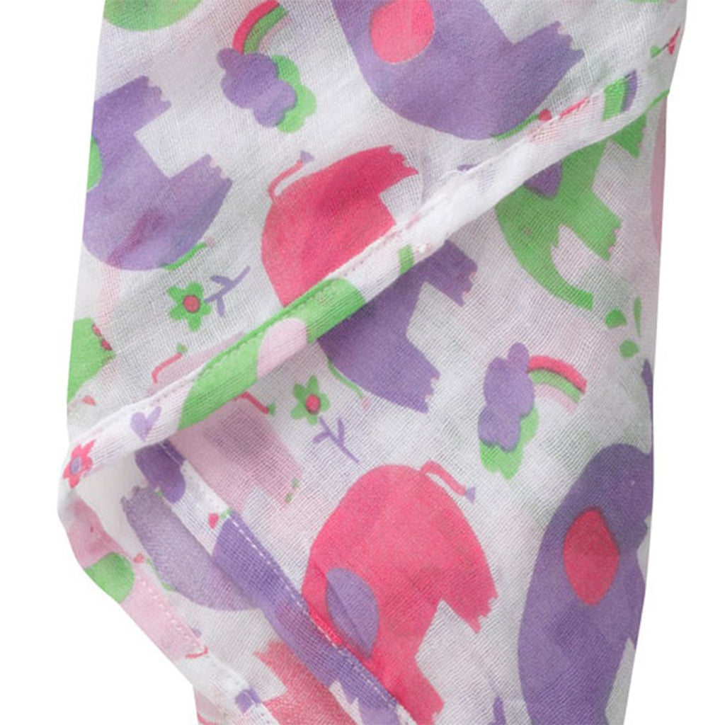 close up of the Organic piccalilly pink purple and green elephant muslin swaddle for baby girls