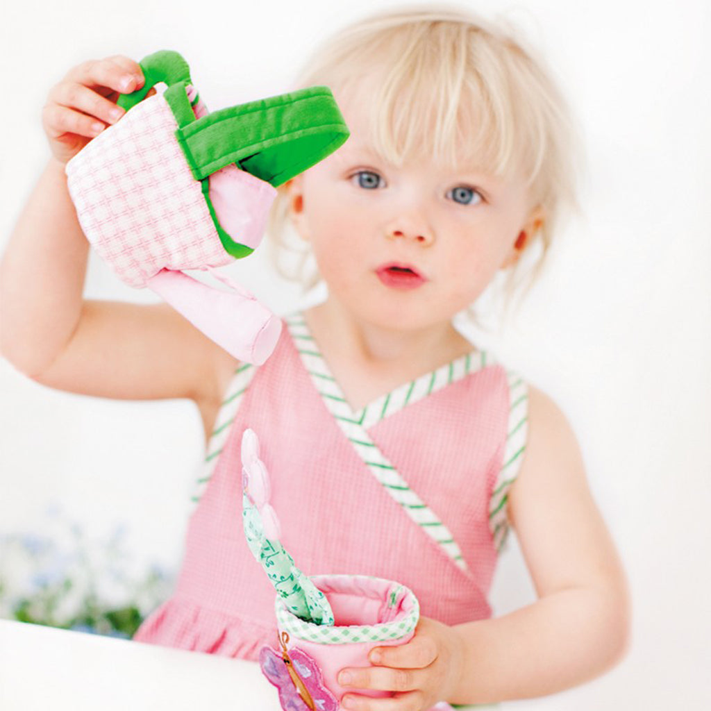 Beautiful Child showing oskar and ellen childrens fabric gardening set toy pink basket watering can