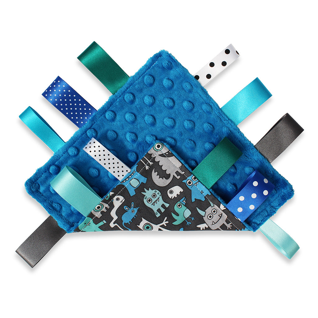 Both sides view of A lovely unique handmade Baby Taggy comforter Professionally made using adorable 'Monsters' fabric