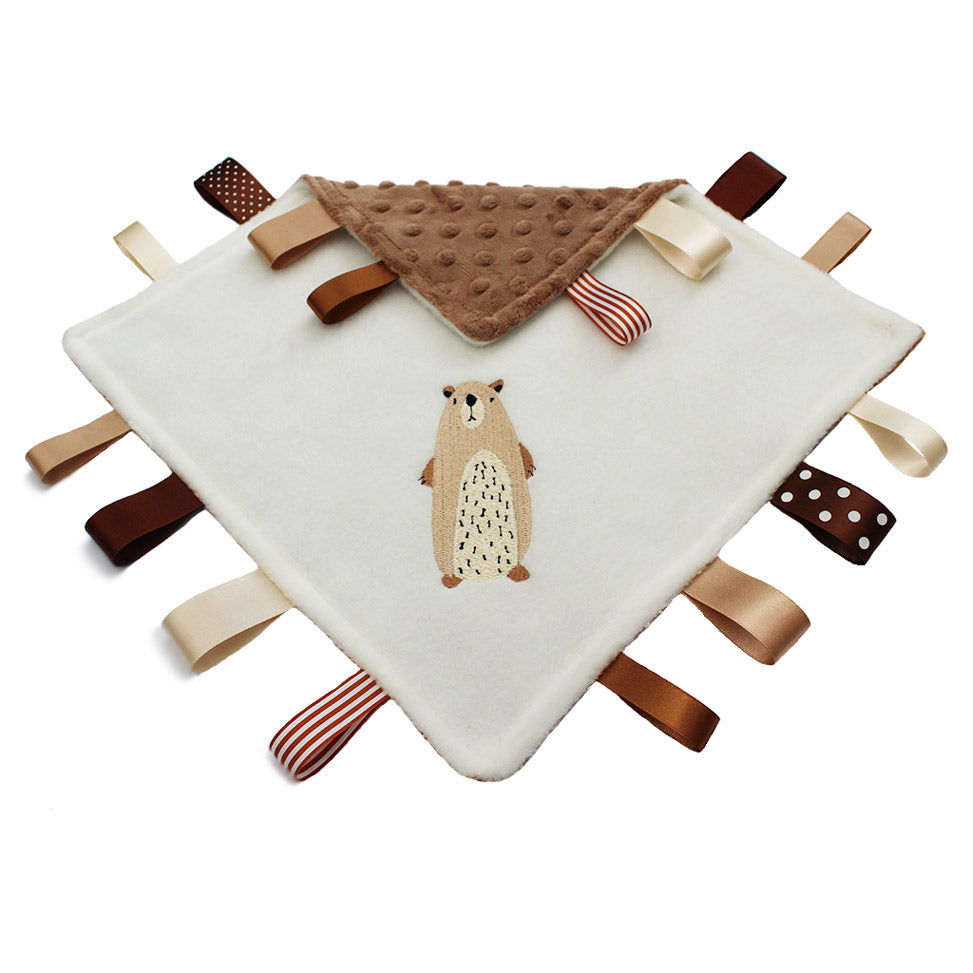 A beautiful baby taggy comforter with a Mountain Bear embroidery design - can be personalised
