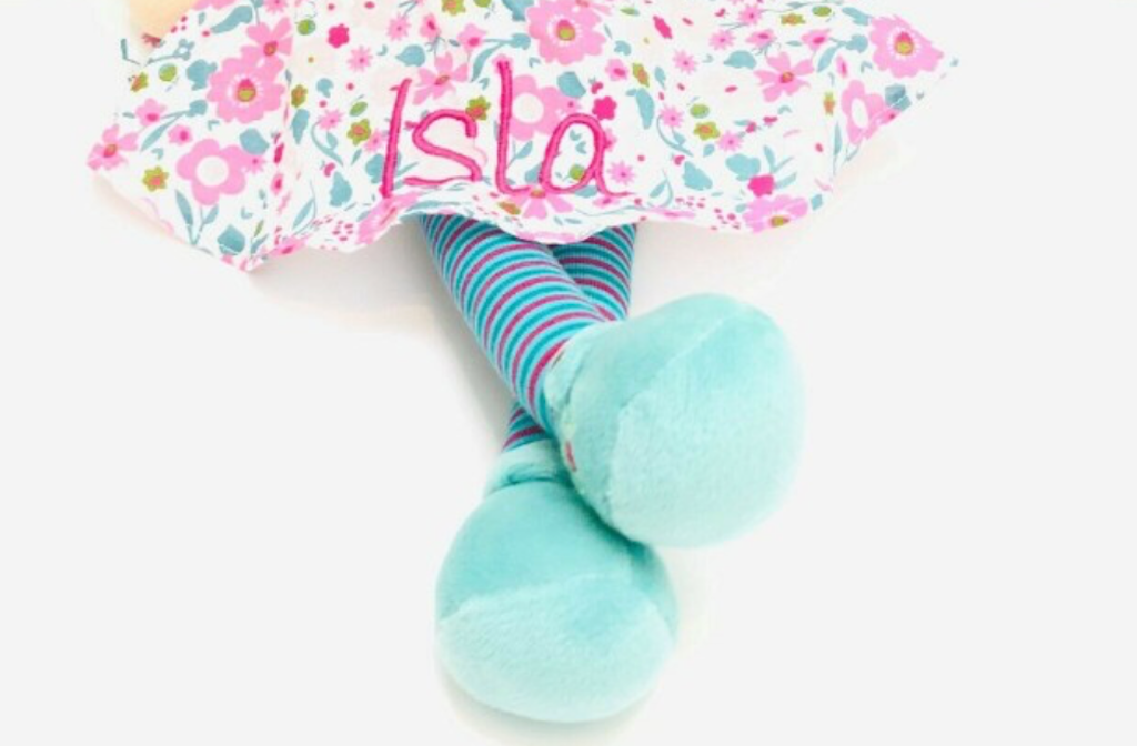 A Fran Rag Doll from Bonikka with a beautiful flowery dress, brown hair showing personalisation name