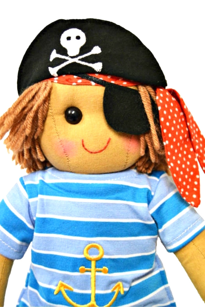 close up look at Powell Craft Rag Doll Pirate at 40cm tall with skull and crossbone hat, eye patch and blue and white stripped shirt