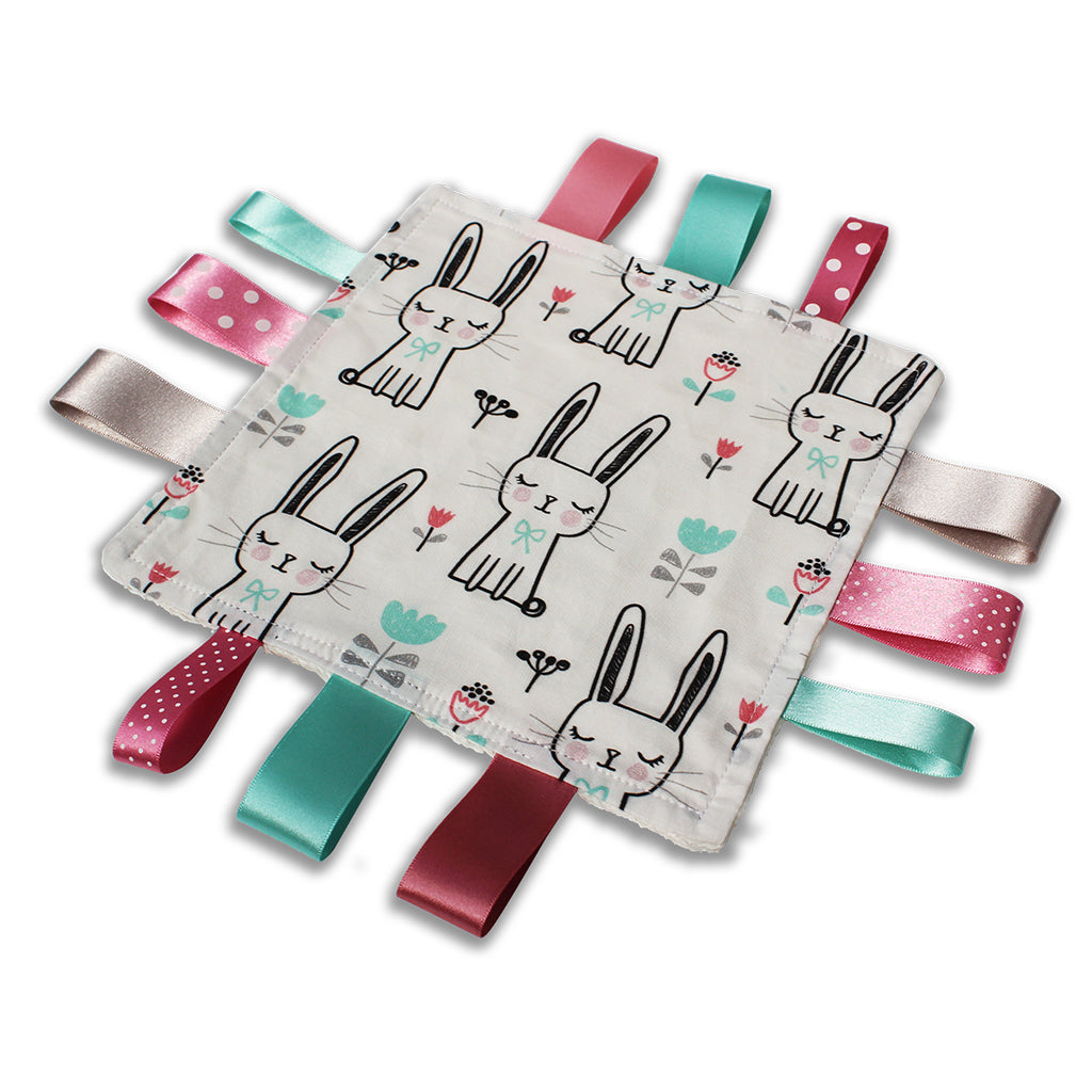 A lovely unique handmade Baby Taggy comforter which can be personalised. 100% soft cotton, printed using an eco-friendly process