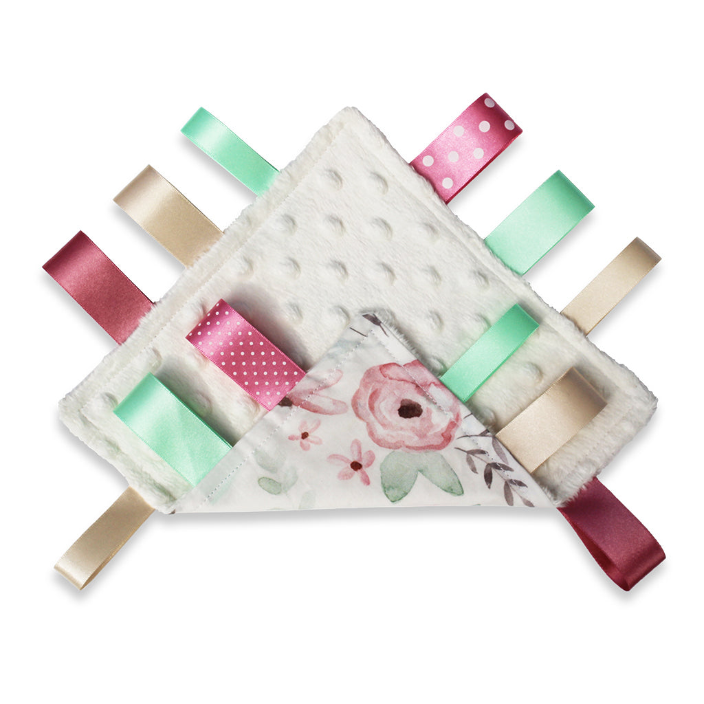 View of both sides of a lovely unique eco friendly handmade Baby Taggy comforter Professionally made using 'Wild Rose' fabric