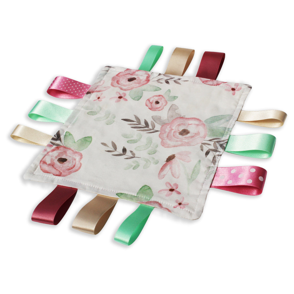 A lovely unique eco friendly handmade Baby Taggy comforter Professionally made using 'Wild Rose' fabric