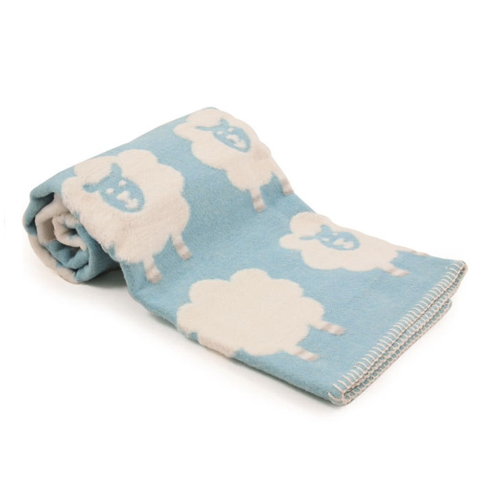 David Fussenegger handmade austrian soft blue blanket with cream fluffy sheep with blanket stitched edges
