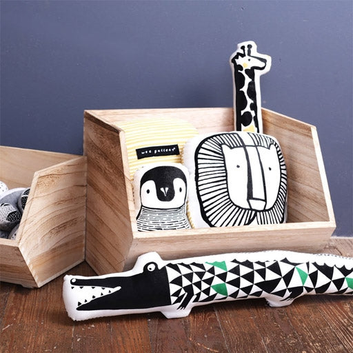 Wee Gallery Crocodile Cushion displayed next to other Wee Gallery cushions