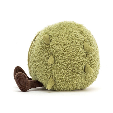 A plush toy resembling a conker, with a soft green shell and a brown body, sitting upright with a happy expression.