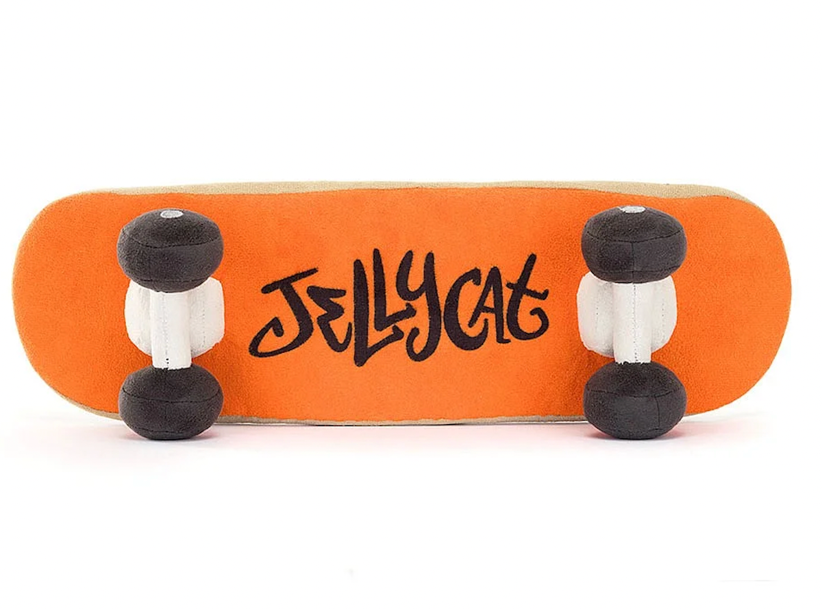A plush toy in the shape of a skateboard . orange backing with jellycat details.