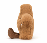  A plush toy resembling a star-shaped cookie with embroidered icing and toffee cord boots, primarily in brown color.