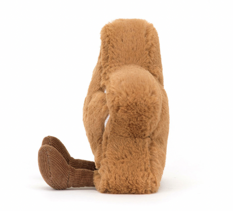  A plush toy resembling a star-shaped cookie with embroidered icing and toffee cord boots, primarily in brown color.