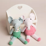 Hand crocheted pink and green elephant toys made from organic bamboo and cotton yarn, designed with big ears and a small tail.