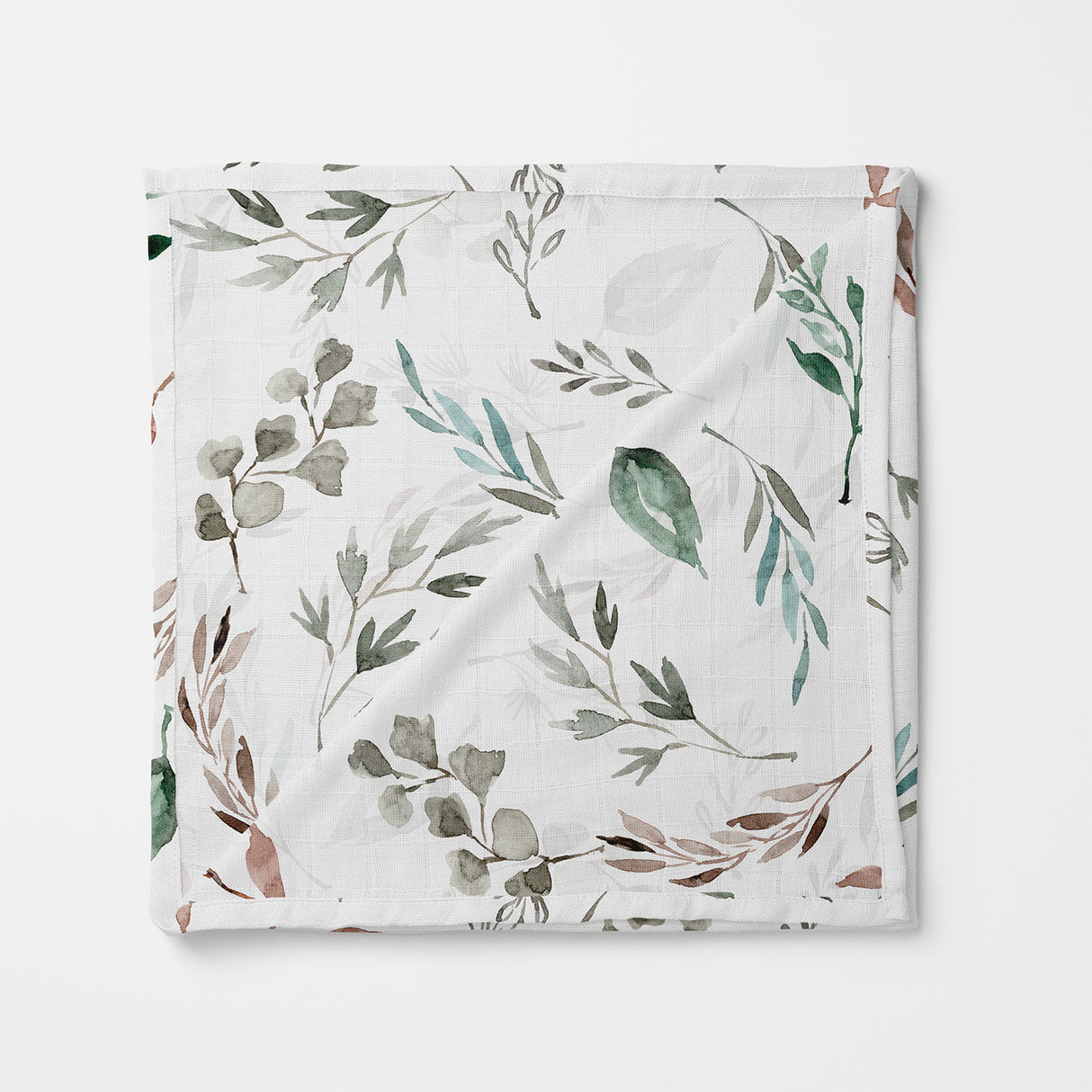 Folded swaddle  with leaf pattern on a white background