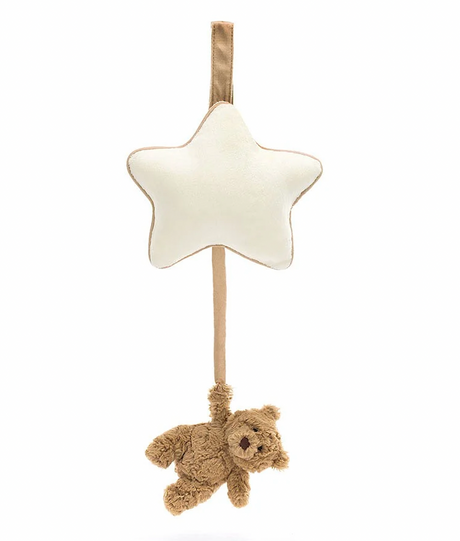 A beige and brown Jellycat musical pull toy in the shape of a star with a small bear hanging from it.