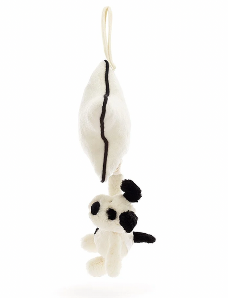 Star-shaped hanging pull toy with a small black and white dog figure on a white background