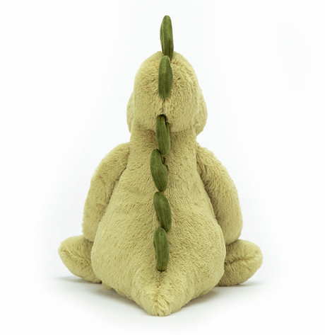 A green soft plush toy dinosaur from behind
