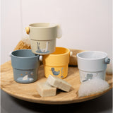 Little Dutch Little Goose bath cups showing stacking and pouring features for toddlers