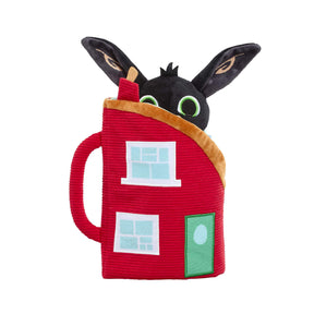 A soft toy set shaped like a red house with a black bunny head peeking out, featuring light blue window panes, a green door, and tan trim, shown on a plain white background.