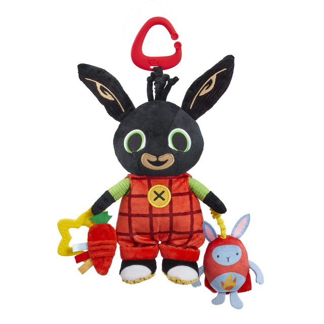 Plush bing baby toy with a black face, red outfit, and colourful accessories on a white background