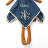 Blue dress with cream flower and embroidered name on a white background