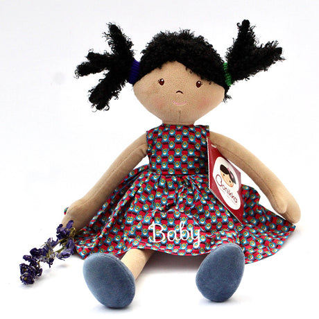 A personalised Bonikka Clara Rag Doll with beautiful dotted embroidered dress and dark hair