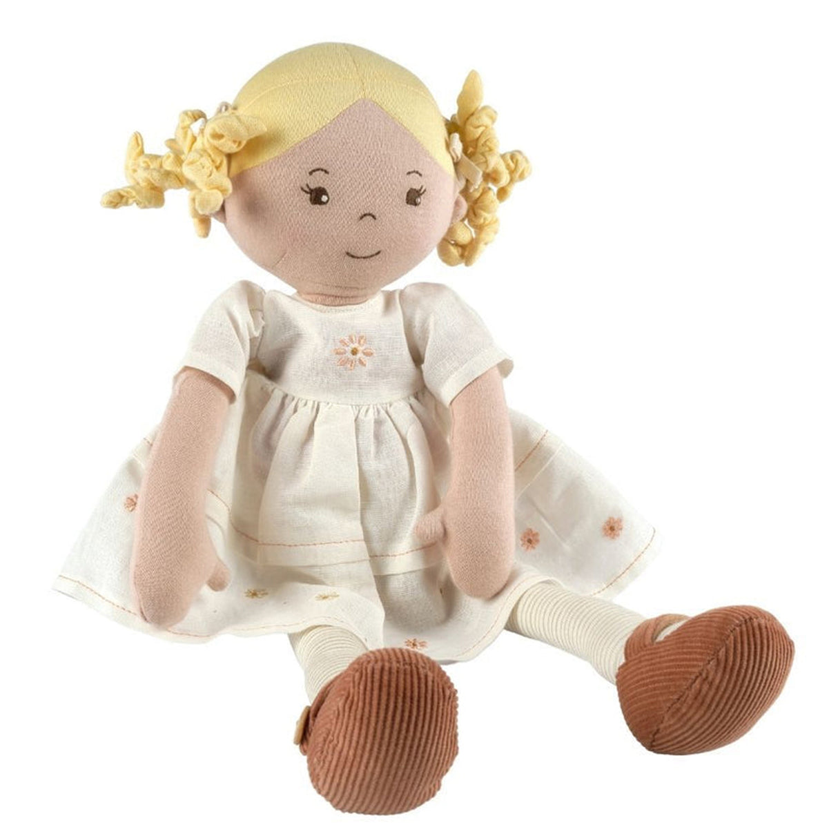 Toy doll with blonde hair and a white dress on a white background