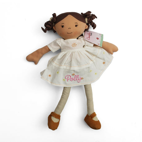 Plush soft rag doll with name Polly personalised on the cream dress which has brown and yellow flowers. The doll also has brown and cream stripey tights and brown shoes on a white background