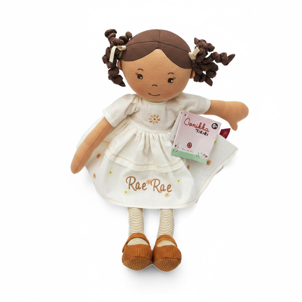Plush soft rag doll with name personalised on the cream dress which has brown and yellow flowers. The doll also has brown and cream stripey tights and brown shoes on a white background
