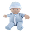 Baby doll in a blue striped outfit and hat on a white background