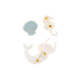 Set of embroidered brooches including a mermaid, seashell, and seahorse 