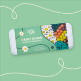 Cotton Twist Daisy Chain bracelet beading kit on a green background