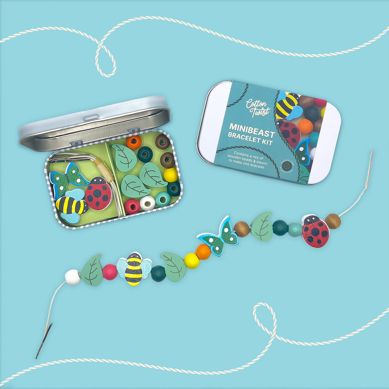 Minibeast bracelet kit with beads and string in a metal tin on a blue background