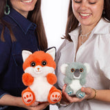 Two women holding Gipsy Toys Cutydoos Fox and Koala small plush soft toys showing size comparison 