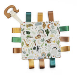 Baby comfort blanket with animals and plants, ribbon tags in browns and greens and wooden elephent teether attached