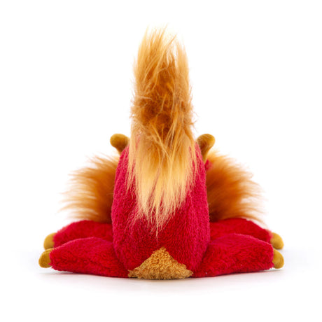 Plush toy resembling a red creature with a long tail on a white background