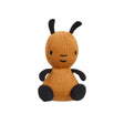 A small flop knitted plush toy with 
black antennae, black arms, and black feet, from the bing tv show