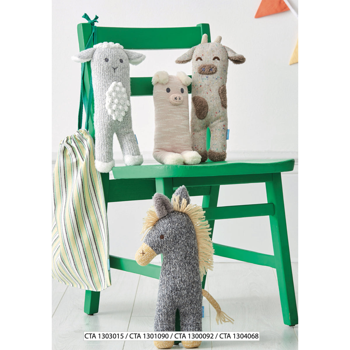 Four knitted animal plush toys arranged on and around a bright green chair: a white lamb, a pig, a spotted cow, and a horse with a yellow mane.