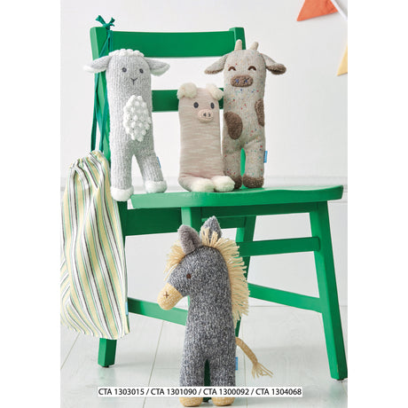 Four knitted animal plush toys arranged on and around a bright green chair: a white lamb, a pig, a spotted cow, and a horse with a yellow mane.